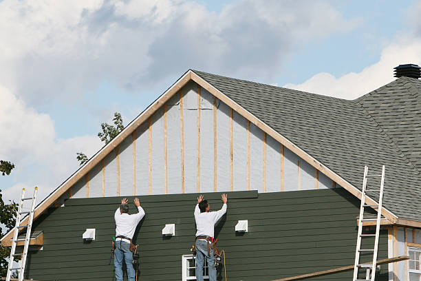 Professional Storm Damage Siding Repair technician working in Ada, MN